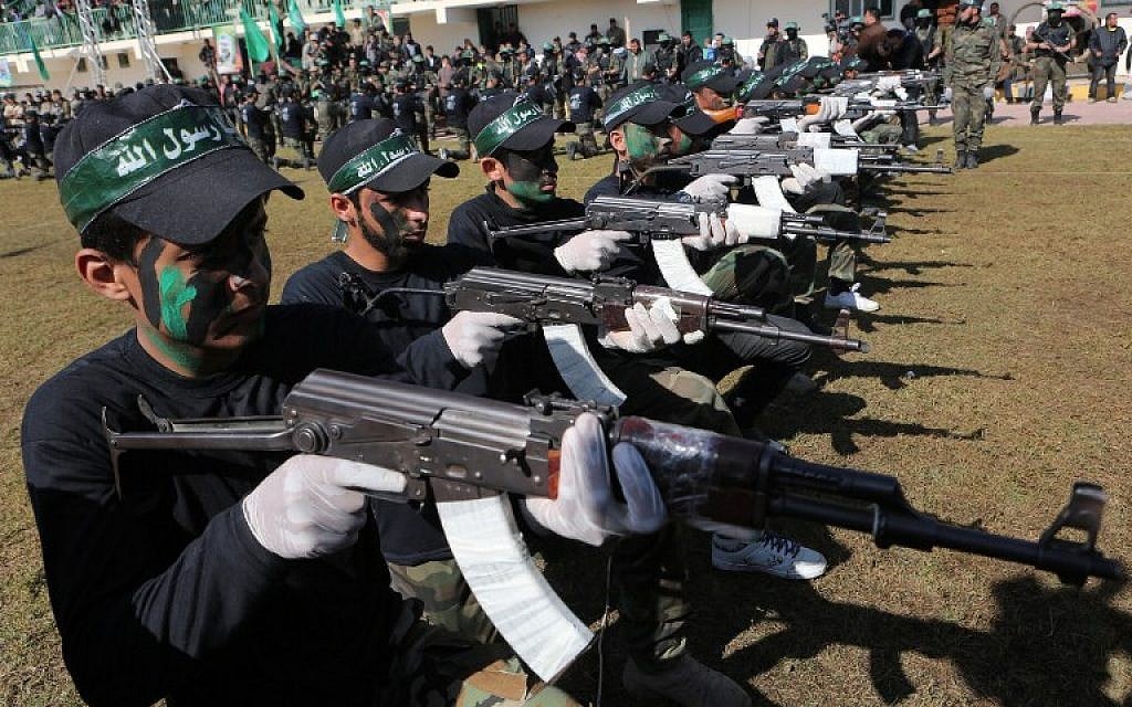 A file picture taken on January 29, 2015, shows Palestinian youth showing their skills during a graduation ceremony as part of a training camp run by the Hamas movement in Khan Yunis, in the southern Gaza Strip. (AFP photo/Said Khatib)