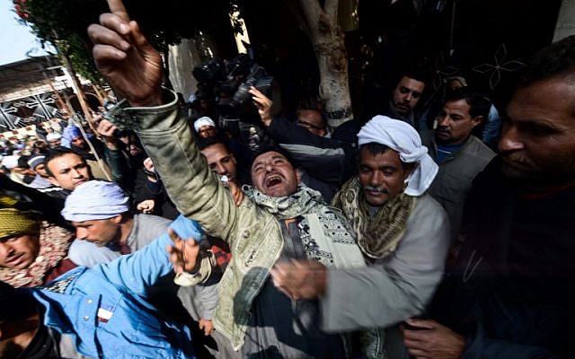 A relative of one of the Egyptian Coptic Christians purportedly murdered by Islamic State (IS) group militants in Libya reacts after hearing the news on February 16, 2015 in the village of Al-Awar in Egypt's southern province of Minya. (photo credit: AFP photo/Mohamed El-Shahed) A relative of one of the Egyptian Coptic Christians purportedly murdered by Islamic State (IS) group militants in Libya reacts after hearing the news on February 16, 2015 in the village of Al-Awar in Egypt's southern province of Minya. (photo credit: AFP photo/Mohamed El-Shahed)