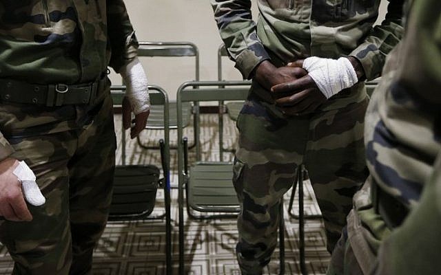 The three soldiers who were attacked by a man wielding a knife while they were patrolling outside a Jewish community center in Nice, France, February 3, 2015. (photo credit: AFP/VALERY HACHE) The three soldiers who were attacked by a man wielding a knife while they were patrolling outside a Jewish community center in Nice, France, February 3, 2015. (photo credit: AFP/VALERY HACHE)