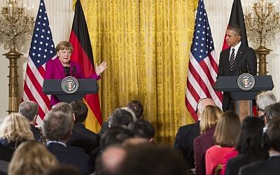 US President Barack Obama and German Chancellor Angela Merkel hold a joint press conference in the East Room of the White House in Washington, DC, February 9, 2015. (photo credit: Saul Loeb/AFP) 