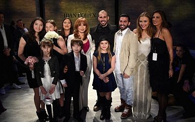 Lennon Stella and Maisy Stella attend the marriage of Israeli fashion designer, Idan Cohen (fourth from R) to his partner, Elad Borenstein (third from R) during Mercedes-Benz Fashion Week Fall 2015 at The Pavilion at Lincoln Center on February 14, 2015 in New York City. (photo credit: Andrew H. Walker/Getty Images/AFP)