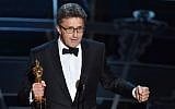 Filmmaker Pawel Pawlikowski accepts the Best Foreign Language Film Award for 'Ida' at the 87th Annual Academy Awards in Hollywood, California, on February 22, 2015. (photo credit: Kevin Winter/Getty Images/AFP)