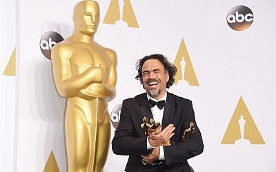 Director Alejandro Gonzalez Inarritu, winner of Best Original Screenplay, Best Director, and Best Motion Picture, for 'Birdman' poses in the press room during the 87th Annual Academy Awards at Loews Hollywood Hotel on February 22, 2015 in Hollywood, California. (photo credit: Jason Merritt/Getty Images/AFP)