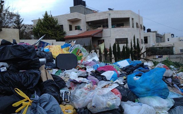 A mound of garbage in Ras Shehadah, a Jerusalem neighborhood located beyond the security barrier, January 26, 2015 (photo credit: Elhanan Miller/Times of Israel)