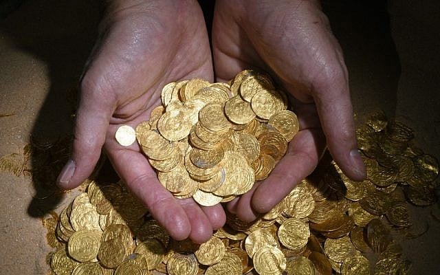 Gold coins found off the coast of Caesarea by divers (photo credit: Clara Amit, courtesy of the Israel Antiquities Authority) Gold coins found off the coast of Caesarea by divers (photo credit: Clara Amit, courtesy of the Israel Antiquities Authority)