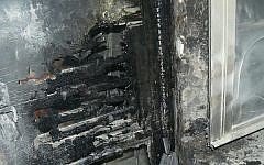 Police open an investigation into the fire at a Greek Orthodox seminary in Jerusalem on Feb. 26, 2015. Ultra-nationalist and anti-Christian graffiti on the walls leads investigators to suspect the fire may have been a hate crime. (Photo credit: Jerusalem Fire Department)