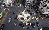 Illustrative photo: Cars passing through central Ramallah. (photo credit: Ilia Yefimovich/Getty Images/JTA)