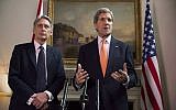 Britain's Foreign Secretary Philip Hammond and US Secretary of State John Kerry, right, deliver a statement at a press conference in London, Saturday Feb, 21, 2015 (AP Photo/Neil Hall/Pool)