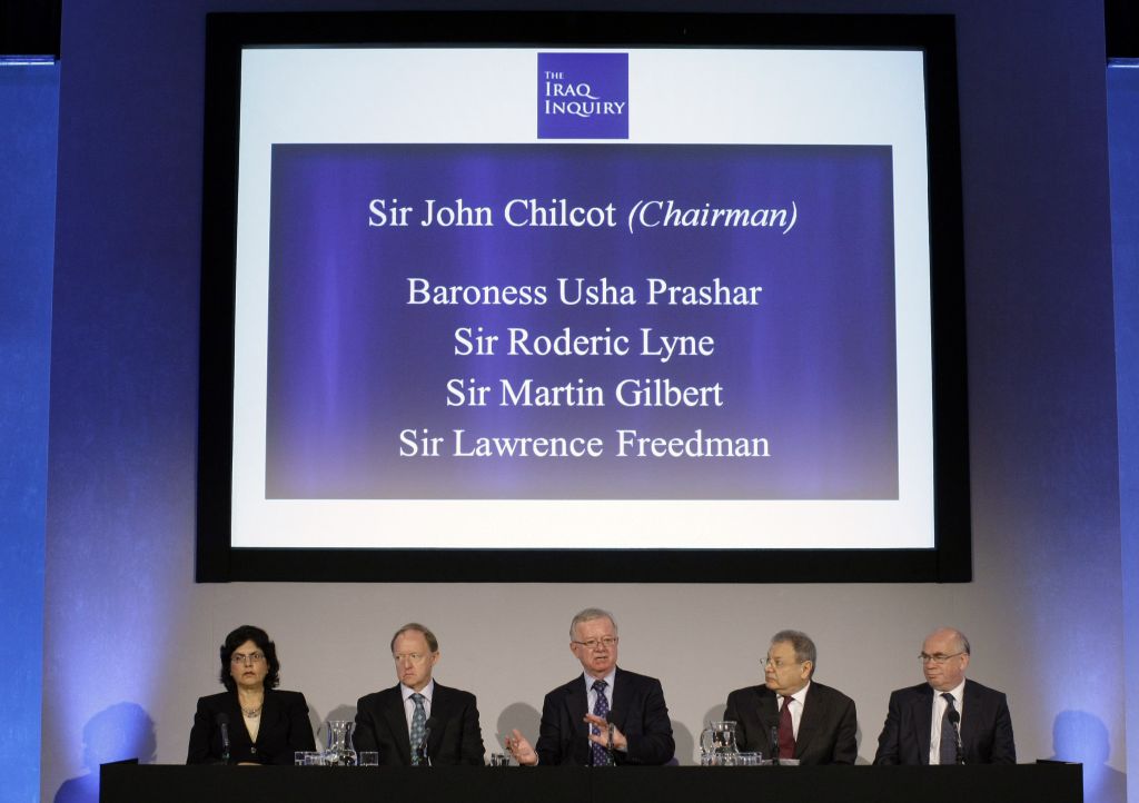 In this Thursday July 30, 2009 file photo, John Chilcot, center, the chairman of the Iraq Inquiry, sits with committee members Baroness Usha Prashar, left, Roderic Lyne, second left, Martin Gilbert, second right, and Lawrence Freedman at the QEII conference centre in London. (AP Photo/Matt Dunham, Pool, File)