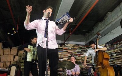Gal Klein and members of the Klezmer fusion band Di Gasn Trio play at the YUNG YiDiSH museum at the Central Bus Station in Tel Aviv on Tu Bishvat. (photo: Avital Parness/Times of Israel)