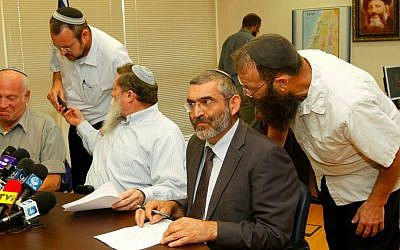 Former MK Michael Ben Ari, second from right, listening to his aide Baruch Marzel prior to a meeting with the National Union party, June 27, 2011. Left of Ben Ari sits MK Yaakov Katz. (photo credit: Miriam Alster/Flash90)