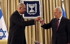 Walid Obeidat (L), the Jordanian ambassador to Israel, toasts with Shimon Peres, at the time the president of Israel, at Obeidat's welcoming ceremony held at the President's residence in Jerusalem. October 17, 2012. (photo credit: Yoav Ari Dudkevitch/FLASH90)