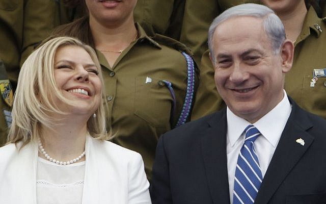 Israeli Prime Minsiter Benjamin Netanyahu and his wife Sara participate in a ceremony for outstanding soldiers as part of Israel's 66th Independence Day celebrations, at the President's residence in Jerusalem. May 06, 2014. (photo credit: Miriam Alster / Flash90, illustrative)