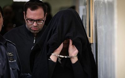 The female suspect of an arson attack in Pisgat Zeev is brought to the Jerusalem Magistrate's Court on February 2, 2015. (photo credit: Hadas Parush/Flash90) 