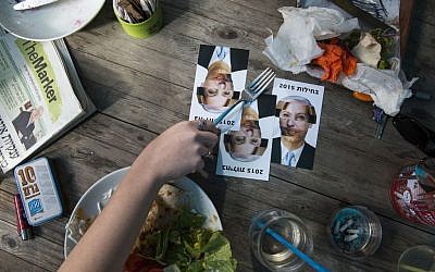Postcards made by an Israeli artist reading 'Nausea 2015,' a play on the Hebrew word for 'elections,' and featuring composite portraits of the various party leaders, can be seen in Tel Aviv, February 5, 2015 (photo credit: Danielle Shitrit/FLASH90)