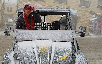 Snow falls in Majdal Shams, in the Golan Heights on February 11, 2015. (photo credit: Basal Awidat/Flash90)