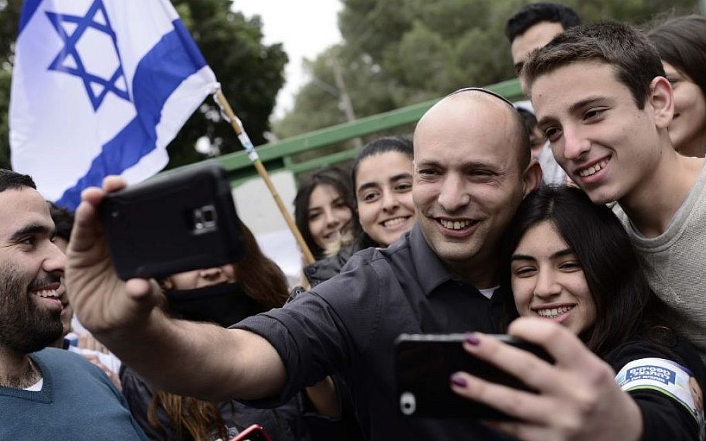 Jewish Home party leader Economy Minister Naftali Bennett, poses with students at the Blich high school in Ramat Gan, Feb 12 2015. (Tomer Neuberg/Flash90) Jewish Home party leader Economy Minister Naftali Bennett, poses with students at the Blich high school in Ramat Gan, Feb 12 2015. (Tomer Neuberg/Flash90)
