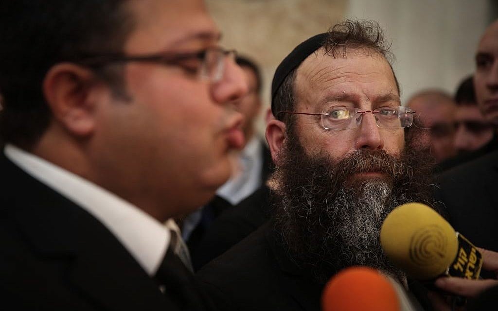Baruch Marzel, with beard, speaking to the press with attorney Itamar ben Gvir at the Supreme Court in Jerusalem on February 17, 2015. (Photo credit: Hadas Parush/FLASH90)