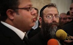 Baruch Marzel, with beard, speaking to the press with attorney Itamar ben Gvir at the Supreme Court in Jerusalem on February 17, 2015. (Photo credit: Hadas Parush/FLASH90)
