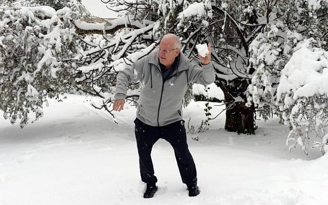 President Reuven Rivlin plays with his grandchildren in his snow-covered garden at the President's residence in Jerusalem after a snow storm hit the capital. February 20, 2015 (Photo credit: Haim Zach/GPO) President Reuven Rivlin plays with his grandchildren in his snow-covered garden at the President's residence in Jerusalem after a snow storm hit the capital. February 20, 2015 (Photo credit: Haim Zach/GPO)