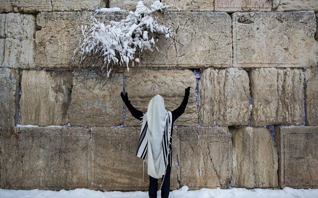 An ultra-Orthodox Jewish man prays at the Western Wall, in Jerusalem's Old City, on a snowy winter morning. February 20, 2015. (Photo credit: Yonatan Sindel/Flash90) An ultra-Orthodox Jewish man prays at the Western Wall, in Jerusalem's Old City, on a snowy winter morning. February 20, 2015. (Photo credit: Yonatan Sindel/Flash90)