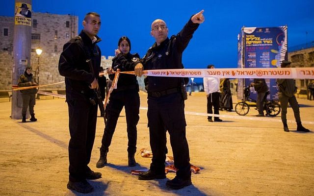 Israeli police at the scene where a Palestinian man stabbed a 27-year-old ultra-Orthodox Jewish man, near Jerusalem City Hall, February 22, 2015. (photo credit: Yonatan Sindel/Flash90) Israeli police at the scene where a Palestinian man stabbed a 27-year-old ultra-Orthodox Jewish man, near Jerusalem City Hall, February 22, 2015. (photo credit: Yonatan Sindel/Flash90)