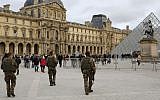 French soldiers as they patrol near the Louvre Museum in Paris, January 10, 2015. (photo credit: AP/Laurent Cipriani, File)