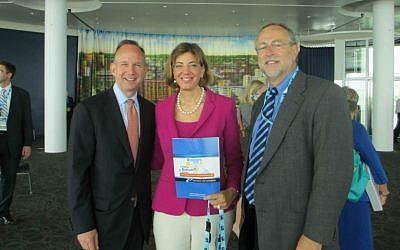 Jennifer Laszlo Mizrahi is flanked by Delaware Gov. Jack Markell, left, and RespectAbility board member Doc Sweitzer at the 2013 launch of A Better Bottom Line, a National Governors Association guide for employing people with disabilities. (Courtesy of RespectAbility/JTA)