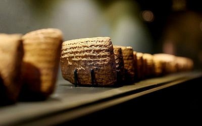 This undated photo provided by the Bible Lands Museum Jerusalem shows tablets with cuneiform writing, one of the world's earliest scripts, on display in Jerusalem. (AP Photo/Avi Noam, Bible Lands Museum)
