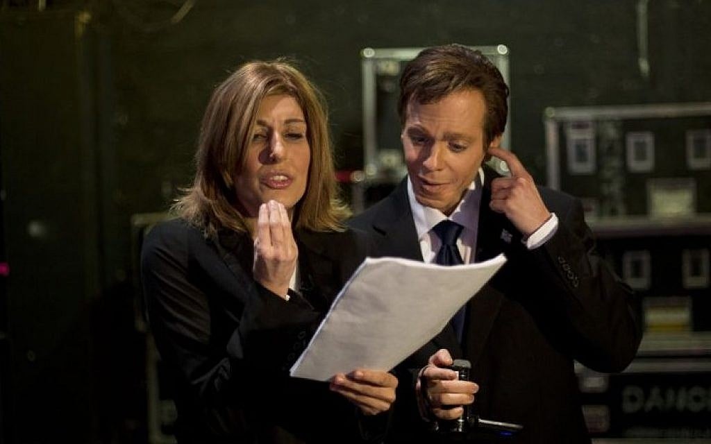 Comedians Roy Bar-Natan, right, and Shani Cohen read a script ahead of a recording of "Eretz Nehederet," a biting TV satire show, in Herzliya, Israel, January 26, 2015 (Photo credit: Ariel Schalit/AP) Comedians Roy Bar-Natan, right, and Shani Cohen read a script ahead of a recording of "Eretz Nehederet," a biting TV satire show, in Herzliya, Israel, January 26, 2015 (Photo credit: Ariel Schalit/AP)