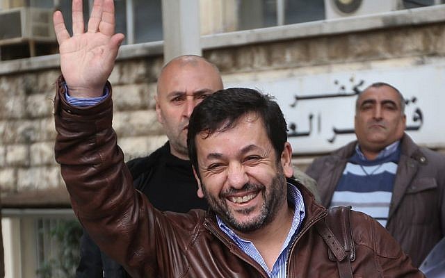 Lebanese satirist Charbel Khalil waves to his supporters after he appeared before a prosecutor at the judicial palace in Beirut, Lebanon, Monday, Feb 23, 2015. (photo credit: AP Photo/Hussein Malla) Lebanese satirist Charbel Khalil waves to his supporters after he appeared before a prosecutor at the judicial palace in Beirut, Lebanon, Monday, Feb 23, 2015. (photo credit: AP Photo/Hussein Malla)