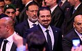 Former Lebanese prime minister Saad Hariri (center), escorted by his bodyguards, arrives at a ceremony to mark the 10th anniversary of the assassination of his father, former prime minister Rafik Hariri, Beirut, Lebanon, February 14, 2015. (photo credit: AP/Hussein Malla)