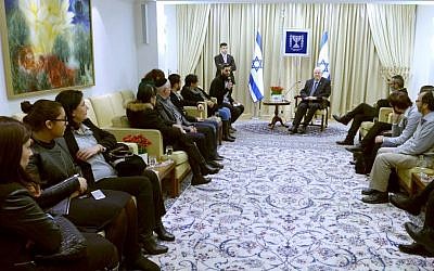 President Reuven Rivlin meets with members of the Cohen, Braham and Saada families, whose loved ones were murdered in a terror attack on a kosher supermarket in Paris last month, on February 9, 2015. (photo credit: Mark Neyman/GPO)
