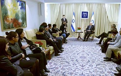 President Reuven Rivlin meets with the families of the victims of last month's terror attack at a kosher supermarket, in Paris, February 9, 2015. (Photo credit: Mark Neyman/GPO)