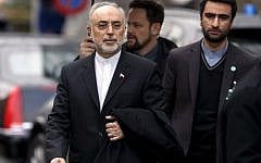 Ali Akbar Salehi, head of Iran's Atomic Energy Organization, left, leaves the hotel following a bilateral meeting with US negotiators, among them US Secretary of State John Kerry, at a round of nuclear talks in Geneva, Switzerland, Monday, Feb. 23, 2015. (photo credit: AP Photo/Keystone, Salvatore Di Nolfi)