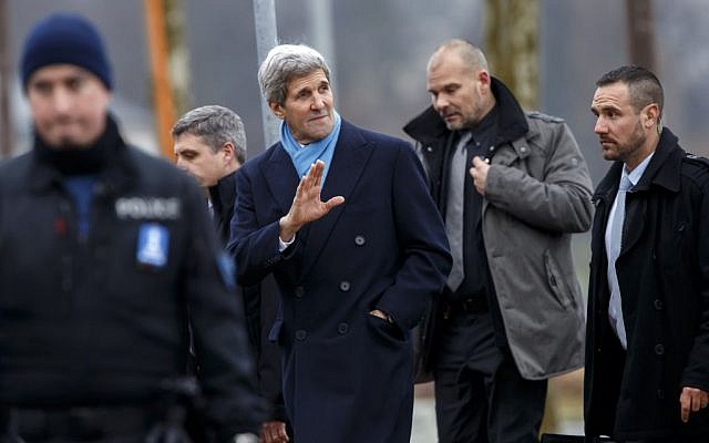 U.S. Secretary of State John Kerry, center, returns to his hotel after walking on the bank of Lake Geneva, following a bilateral meeting with Iranian Foreign Minister Mohammad Javad Zarif in Geneva, Switzerland, Monday, Feb. 23, 2015. (photo credit: AP Photo/Keystone, Salvatore Di Nolfi)