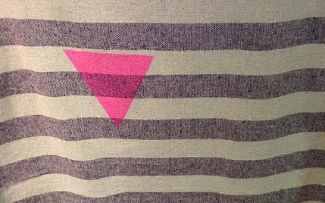 An Urban Outfitters tapestry the ADL says is reminiscent of uniforms gay prisoners were forced to wear at Nazi concentration camps. (Photo credit: ADL)