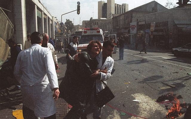 A woman is evacuated for medical treatment after a female suicide bomber blew herself up in the center of Jerusalem, January 27, 2002. (Flash90) A woman is evacuated for medical treatment after a female suicide bomber blew herself up in the center of Jerusalem, January 27, 2002. (Flash90)