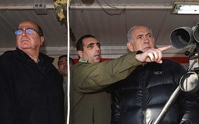 File: Prime Minister Benjamin Netanyahu, right, Ofek Buchris, center, and Defense Minister Moshe Ya'alon seen at Mount Hermon, overlooking the Israeli border with Syria. February 04, 2015. (Effi Sharir/POOL)