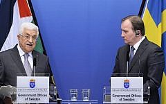 Prime Minister of Sweden Stefan Loefven (R) and Palestinian president Mahmoud Abbas hold a joint press conference in Stockholm on February 10, 2015. (Photo credit: AFP photo/Jonathan Nackstrand)