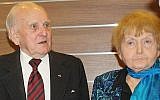 In this January 29, 2015 picture Jozef Paczynski, left, 95, a former Auschwitz prisoner who was the barber to camp commandant Rudolf Hoess, stands next to Eva Mozes Kor, 81, a Jewish survivor of experiments by the sadistic German doctor Josef Mengele, in Krakow, Poland. (photo credit: AP Photo/Alexandra Fletcher)