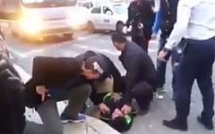 A Palestinian stabber is taken down by security guards in Jerusalem after attacking a 27-year-old Israeli man (photo credit: Screen capture)