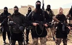 Screen capture from an earlier video released by French-speaking Islamic State members that may show fugitive terror suspect Hayat Boumeddiene (front row Right) who is wanted in France. (screen capture: YouTube/24/7 News online)