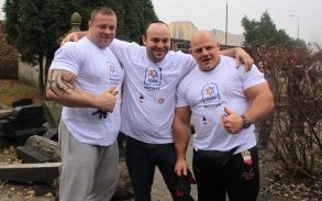 Jonny Daniels, center, with Polish Strongman Federation members in 2014. (Photo credit: courtesy of From the Depths via JTA) Jonny Daniels, center, with Polish Strongman Federation members in 2014. (Photo credit: courtesy of From the Depths via JTA)