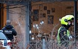 Policemen secure the area around a building in Copenhagen, Denmark, where shots were fired outside the venue of a free-speech debate, February 14, 2015. (photo credit: AFP/Mathias Oegendal/Scanpix Denmark)