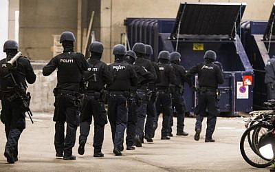 Police forces patrol in a street near the Norrebro Station where the alleged author of two fatal attacks opened fire in the Danish capital before being shot in a police action at another place in Copenhagen on February 15, 2015. (photo credit: AFP/Scanpix Denmark/ Martin Sylvest) Police forces patrol in a street near the Norrebro Station where the alleged author of two fatal attacks opened fire in the Danish capital before being shot in a police action at another place in Copenhagen on February 15, 2015. (photo credit: AFP/Scanpix Denmark/ Martin Sylvest)