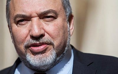 Foreign Minister Avigdor Liberman arrives at the Supreme Court in Jerusalem on February 9, 2014, to file a petition against the Central Election Committee's decision to bar his Yisrael Beytenu party from distributing French satirical magazine Charlie Hebdo. (photo credit: Yonatan Sindel/Flash90)