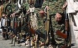 Houthi Shiite Yemenis wearing army uniforms hold their weapons during a rally to show support for their comrades in Sanaa, Yemen, Wednesday, Feb. 4, 2015. (photo credit: AP/Hani Mohammed)