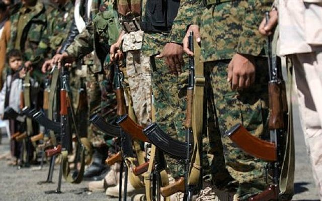 Houthi Shiite Yemenis wearing army uniforms hold their weapons during a rally to show support for their comrades in Sanaa, Yemen, Wednesday, Feb. 4, 2015. (photo credit: AP/Hani Mohammed) Houthi Shiite Yemenis wearing army uniforms hold their weapons during a rally to show support for their comrades in Sanaa, Yemen, Wednesday, Feb. 4, 2015. (photo credit: AP/Hani Mohammed)
