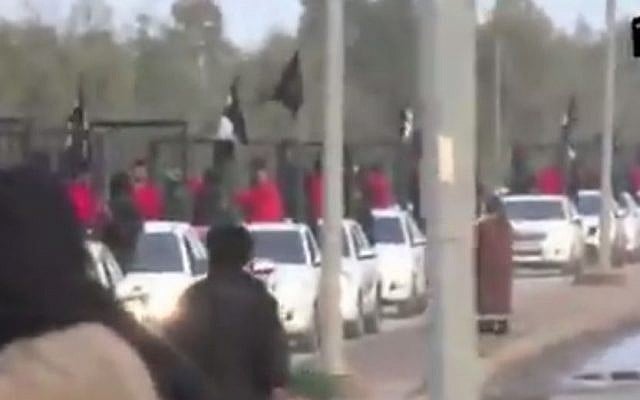 Kurdish fighters paraded in cages by the Islamic State group in a recent video. (screen capture: YouTube)